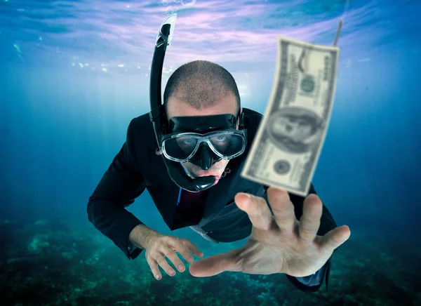 Businessman lured by money — Stock Photo, Image