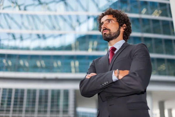 Handsome businessman with arms crossed — Stock Photo, Image