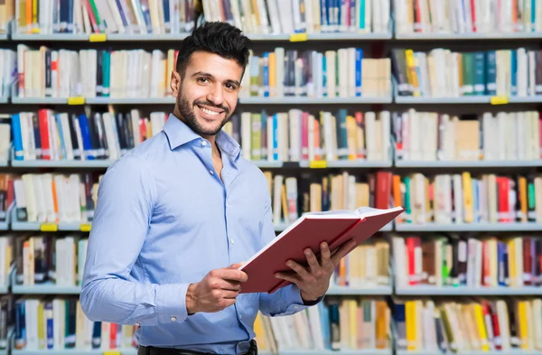 Handsome man holding book — Stock Photo, Image
