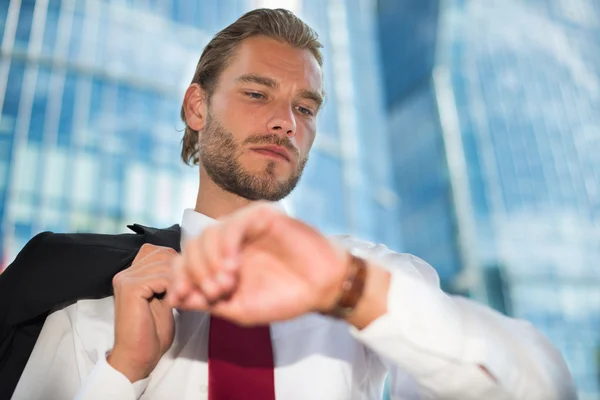 Businessman looking at watch — Stock Photo, Image