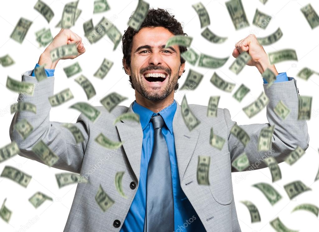 businessman enjoying a rain of money