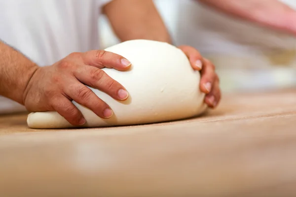 Baker hands  preparing pastry — Stock Photo, Image