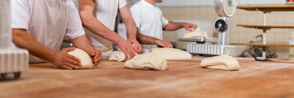 Bakers preparing pastry — Stock Photo, Image