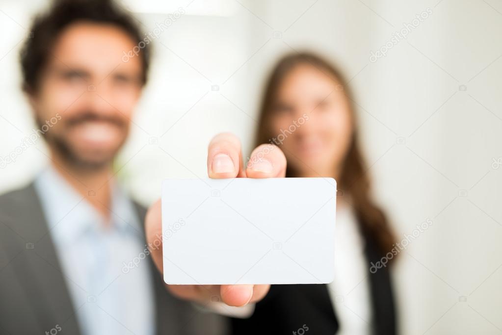 Woman showing a blank business card