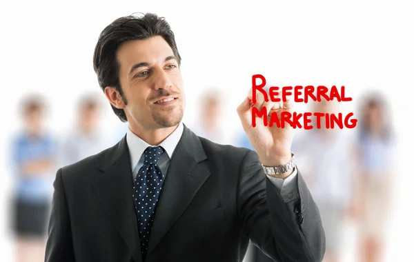 Businessman writing referral marketing — Stock Photo, Image