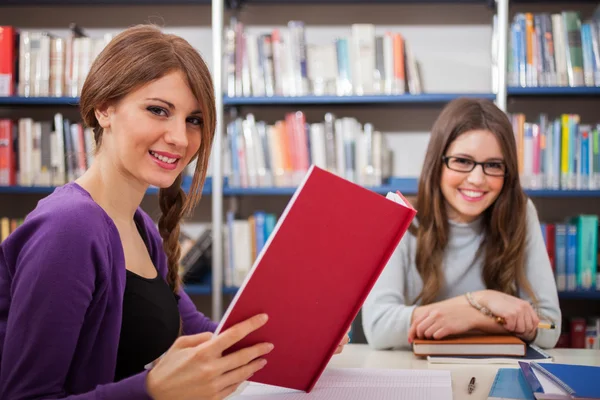 Students studying in library — Stock Photo, Image