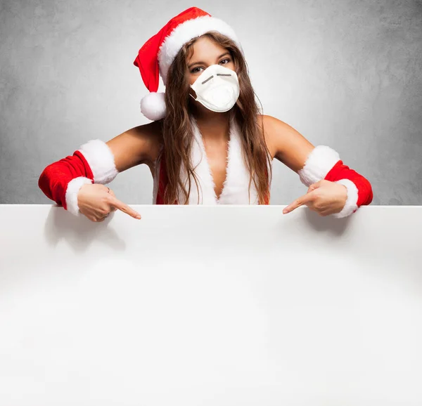 Portrait Woman Wearing Christmas Hat Face Mask Showing Empty Banner — Stok Foto