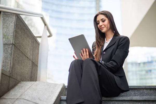 Smiling Businesswoman Using Digital Tablet Outdoor While Sitting Stairs — Stock Photo, Image