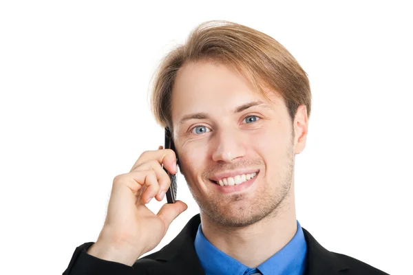 Smiling businessman talking at phone — Stock Photo, Image