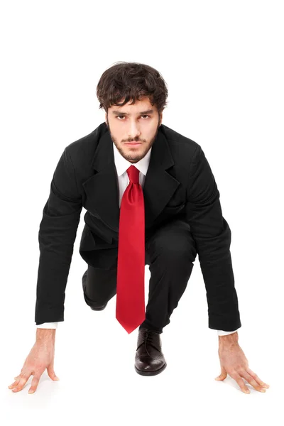 Businessman in starting position — Stock Photo, Image