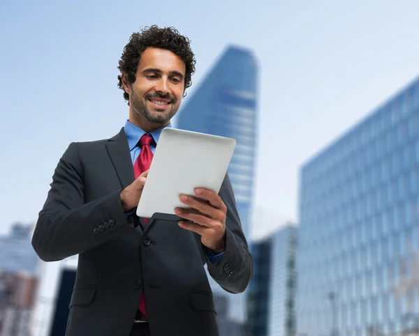 Businessman using his tablet — Stock Photo, Image