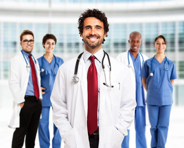 Doctor in front of his team — Stock Photo, Image