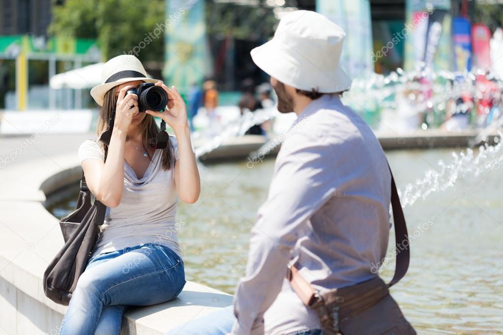 Woman taking picture of boyfriend