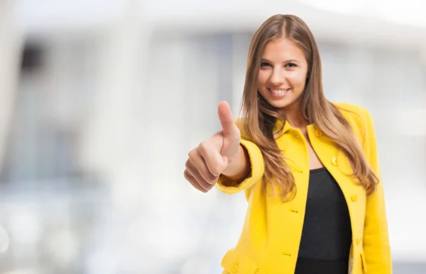 Woman giving thumbs up Stock Image