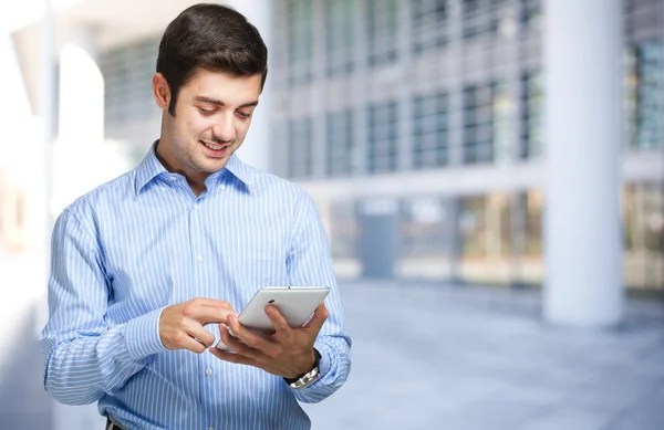 Businessman using tablet outdoor — Stock Photo, Image