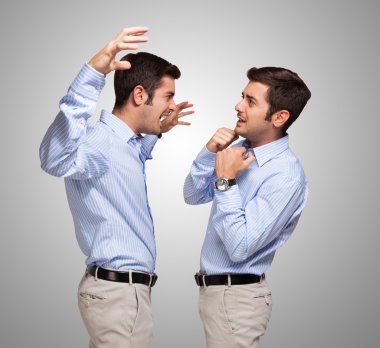 Man attacking frightened clone of himself clipart