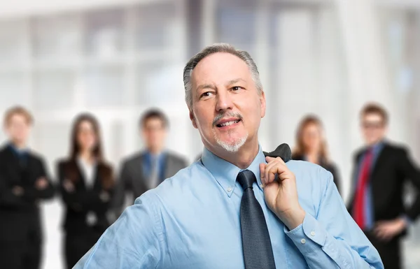 Leader in front of business people — Stock Photo, Image