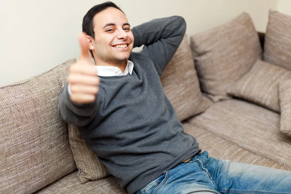 Smiling man giving thumbs up — Stock Photo, Image