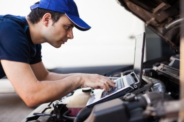 Mechanic check car engine clipart