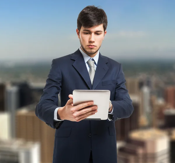 Business man holding his tablet — Stock Photo, Image