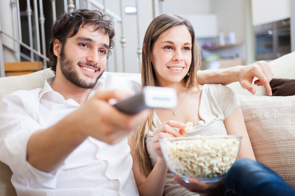 Couple using remote control