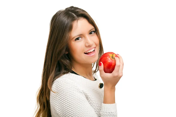 Jonge vrouw eten een appel geïsoleerd op wit — Stockfoto