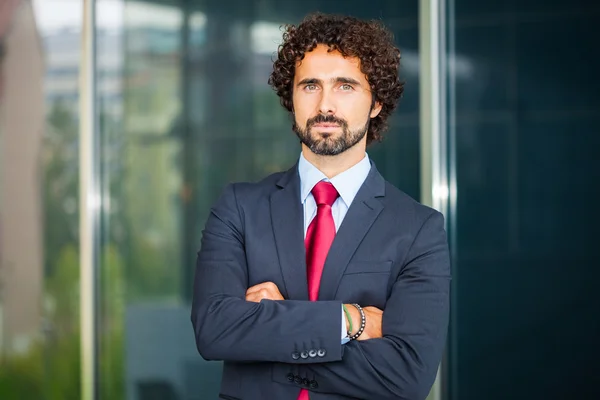 Businessman with his arms folded — Stock Photo, Image