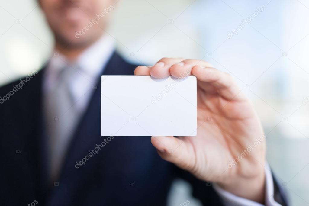 Man showing  business card