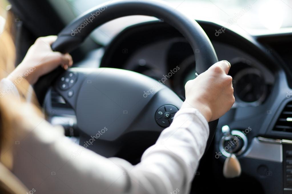 hands on a steering wheel