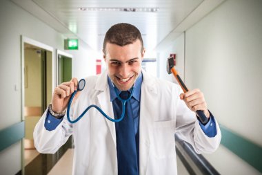Doctor holding an hammer clipart