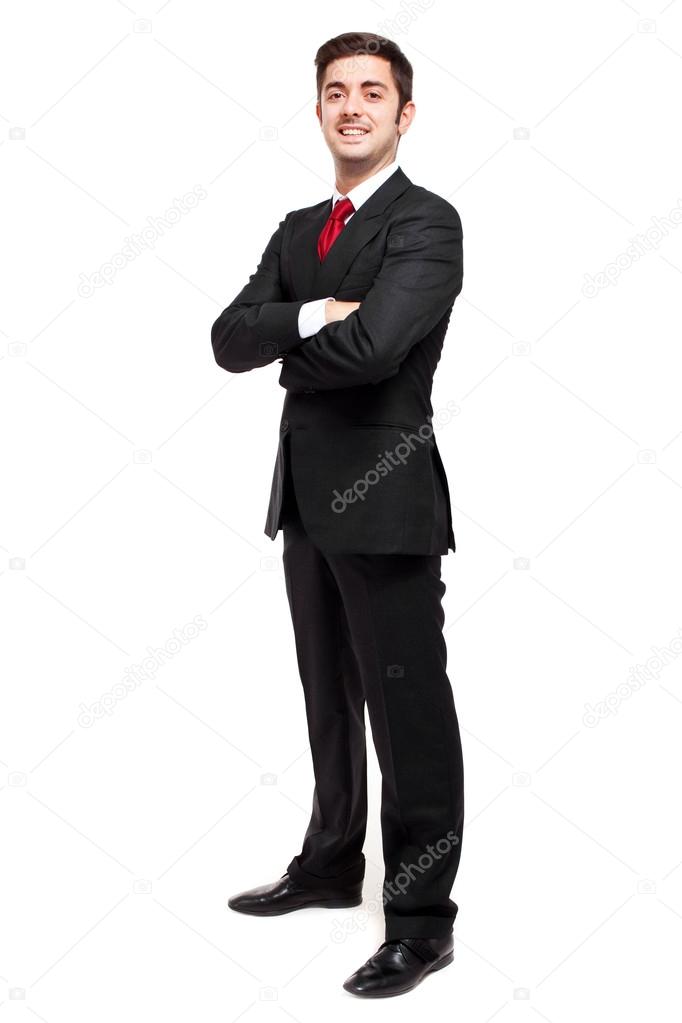 Young businessman with folded arms smiling