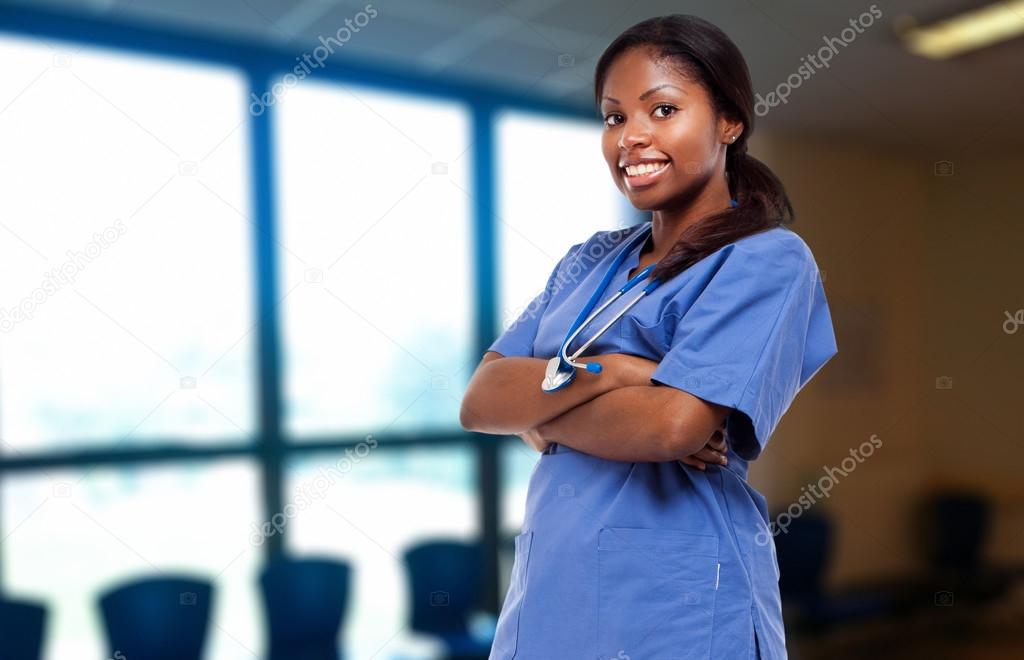 Nurse smiling with her arms folded