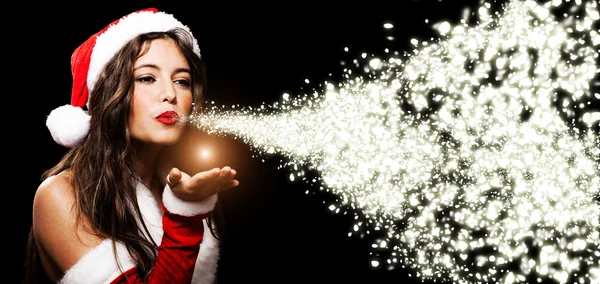 Christmas girl blowing shining snow flakes — Stock Photo, Image