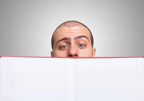 Man looking at an open book — Stock Photo, Image