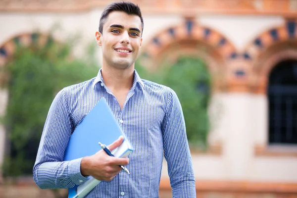 Student in front of his school — Stock Photo, Image