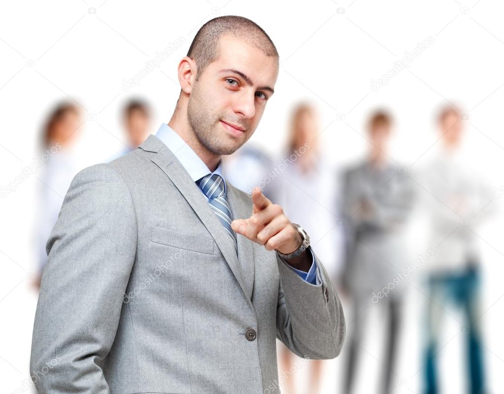 Businessman pointing finger at you