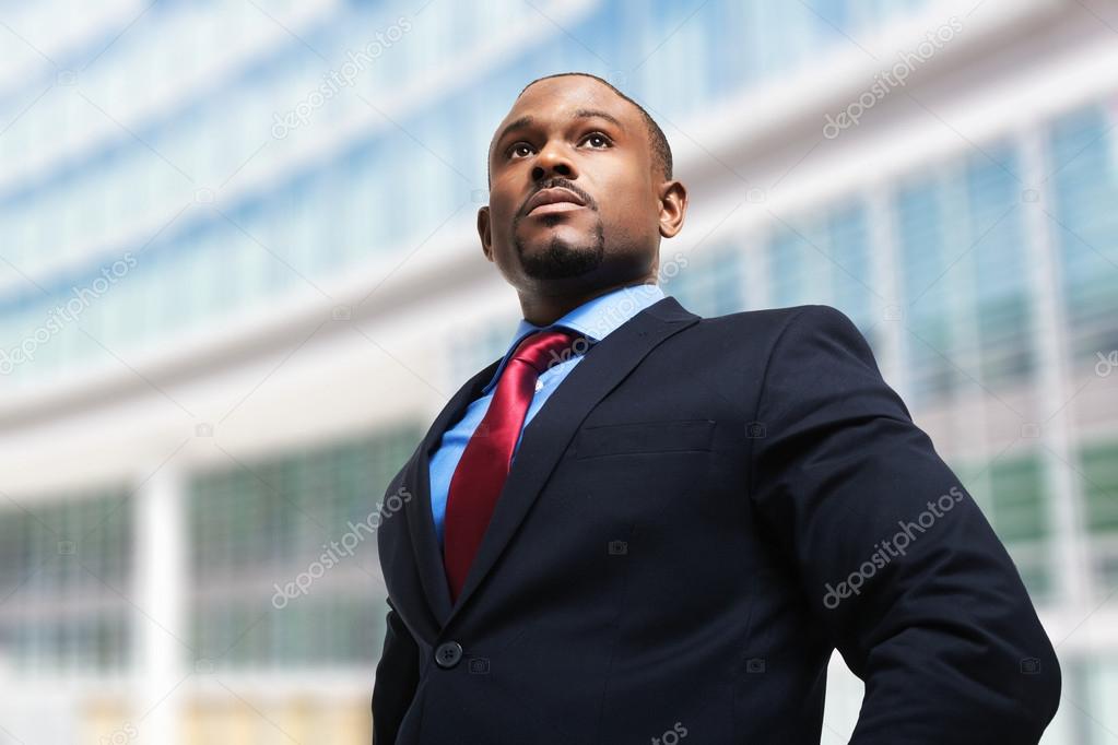 businessman in front of his office