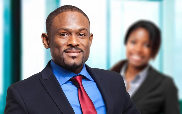 Two african businesspeople smiling — Stock Photo, Image