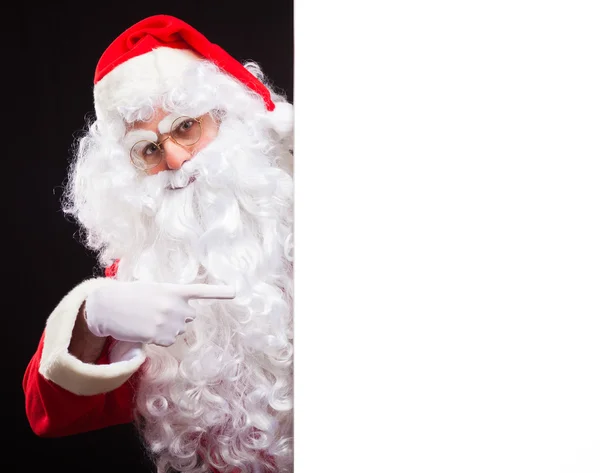Santa Claus mostrando una señal en blanco —  Fotos de Stock
