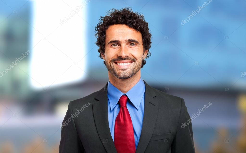 Handsome smiling business man