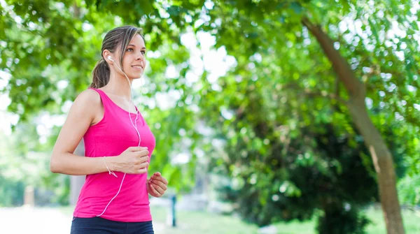 Woman running outdoors — Stock Photo, Image