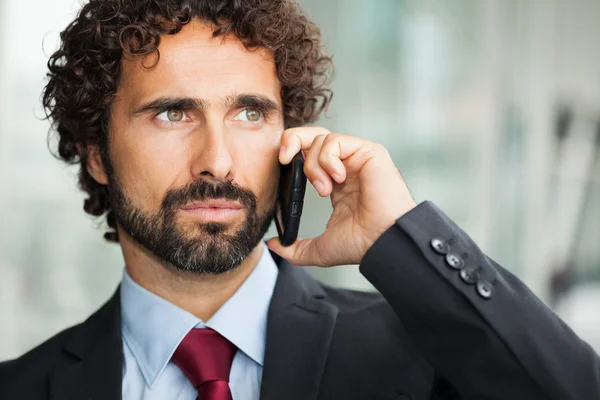 Businessman talking on the phone Royalty Free Stock Images