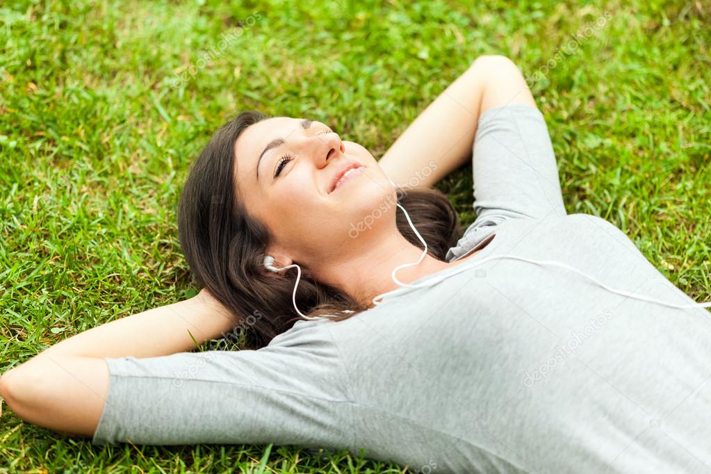 Relaxed woman listening music