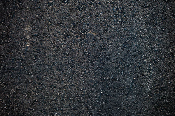 Ciemny szorstki asfalt — Zdjęcie stockowe