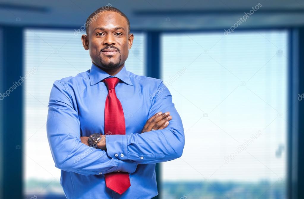 African businessman with crossed arms