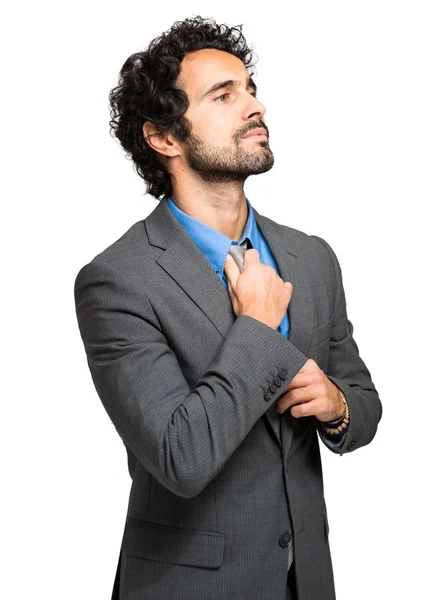 Businessman adjusting his tie — Stock Photo, Image