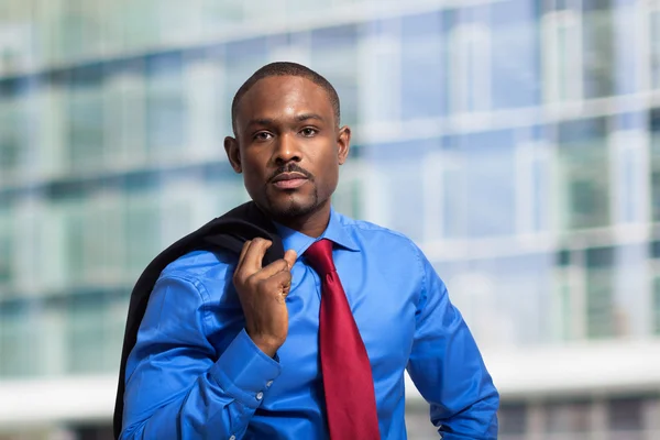 Businessman holding his jacket — Stock Photo, Image