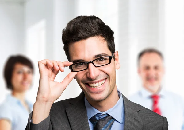 Businessman portrait in front of team — Stock Photo, Image