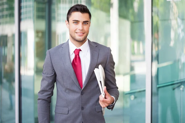 Businessman holding newspaper — Stock Photo, Image