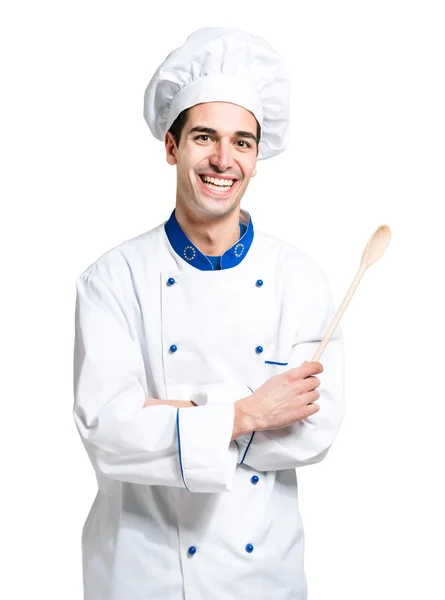 Pohledný šéfkuchař hospodářství vařečka — Stock fotografie